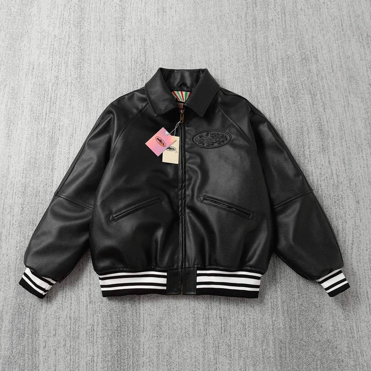 Carhartt-inspired black leather-style varsity jacket